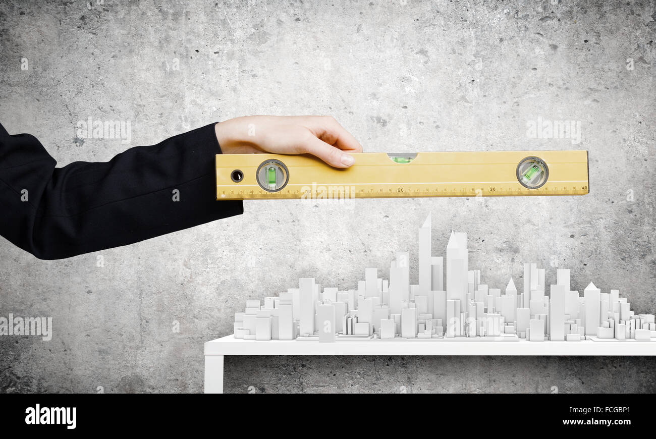 Close up of female hand measuring construction project with ruler Stock ...