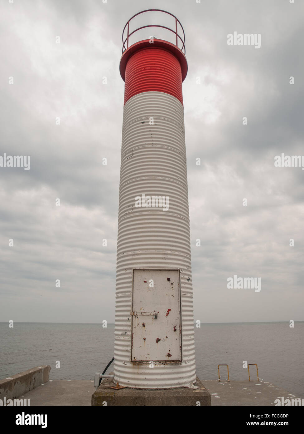 Red and white lighthouse on Lake Ontario in Oakville, Ontario, Canada. Stock Photo