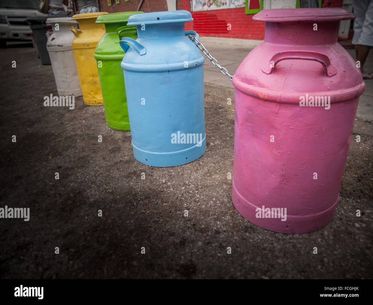 Line of colourful painted milk jugs on the street in Toronto, Ontario