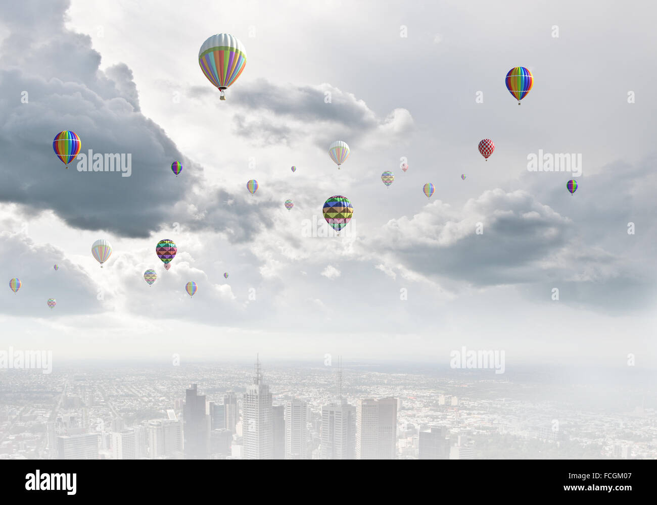 Colorful aerostats flying in clear sky above modern city Stock Photo ...
