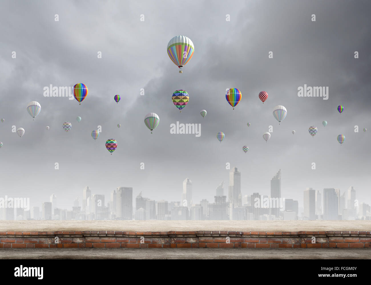 Colorful aerostats flying in clear sky above modern city Stock Photo ...