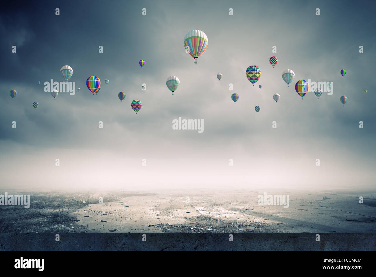 Colorful aerostats flying in clear sky above modern city Stock Photo ...