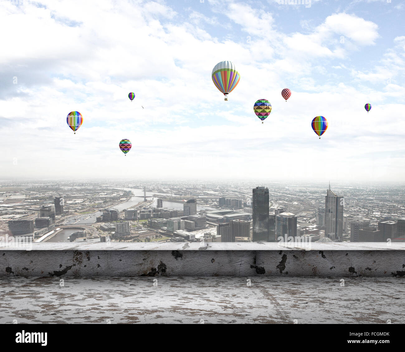 Colorful aerostats flying in clear sky above modern city Stock Photo ...