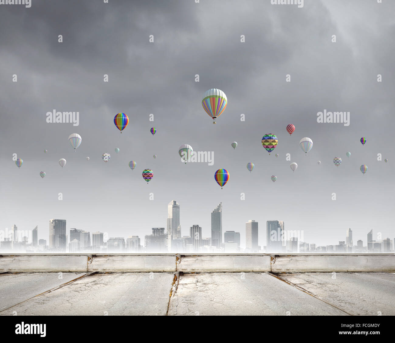 Colorful aerostats flying in clear sky above modern city Stock Photo ...