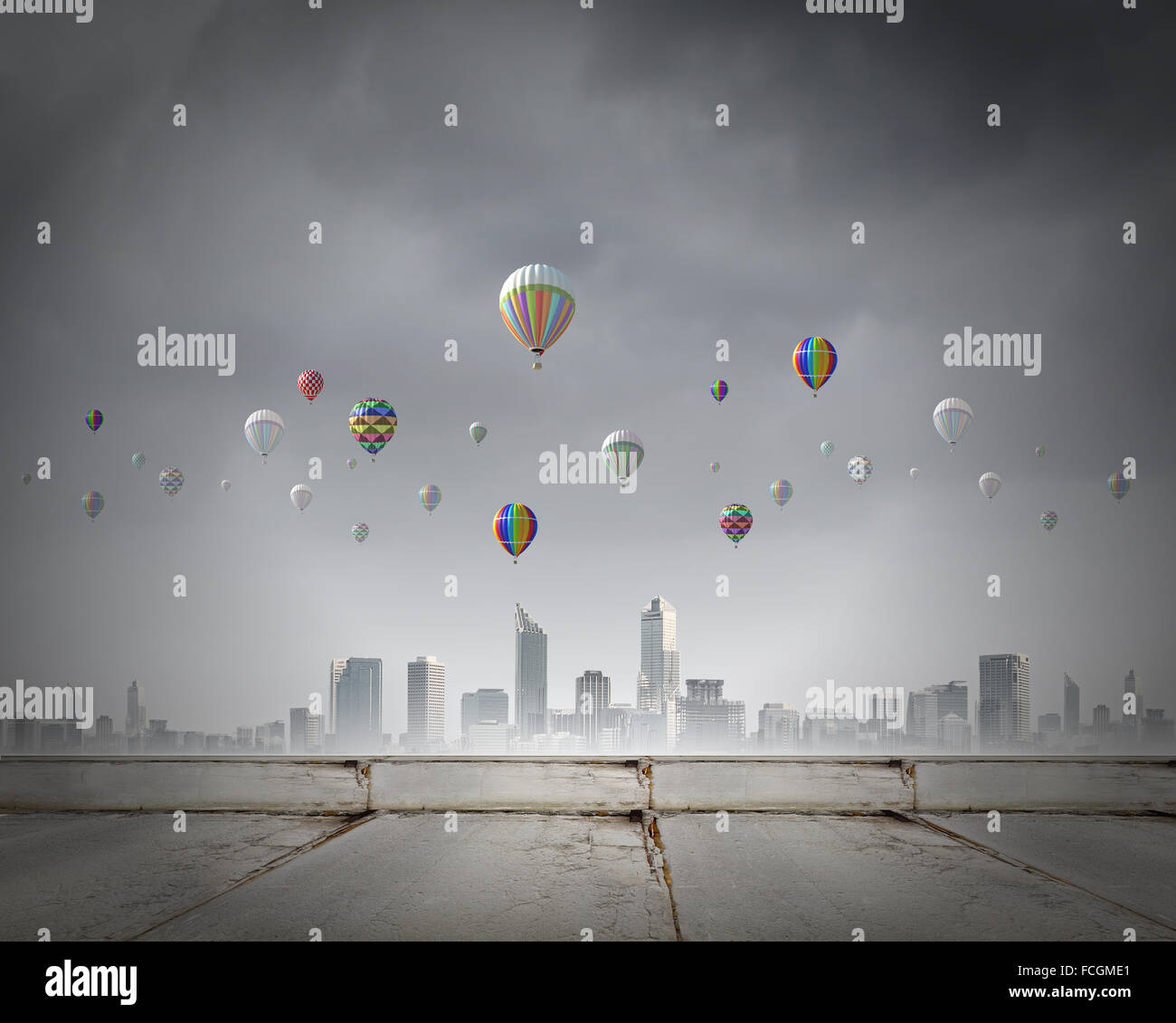 Colorful aerostats flying in clear sky above modern city Stock Photo ...
