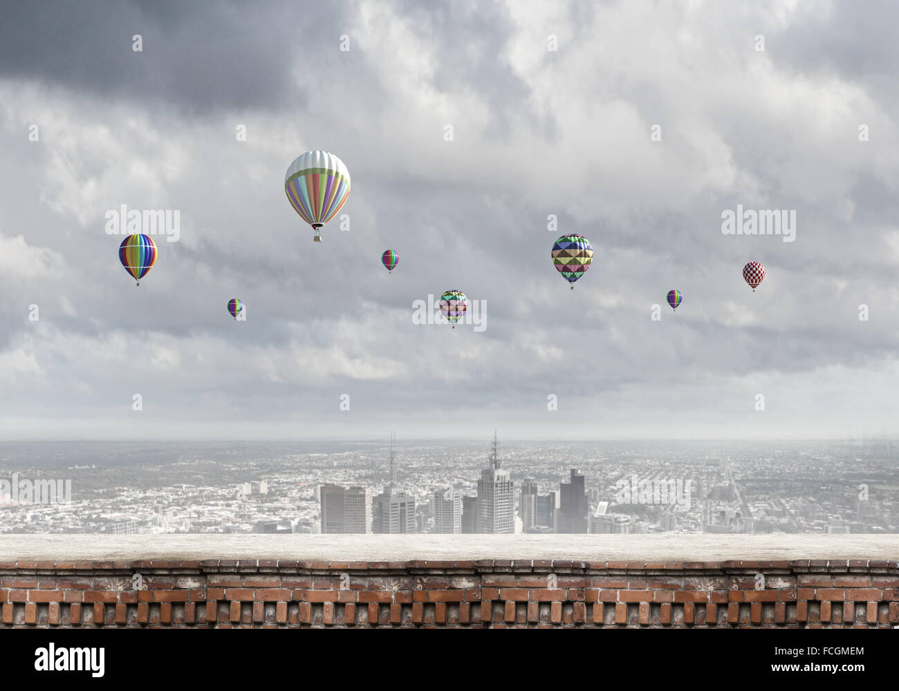 Colorful aerostats flying in clear sky above modern city Stock Photo ...