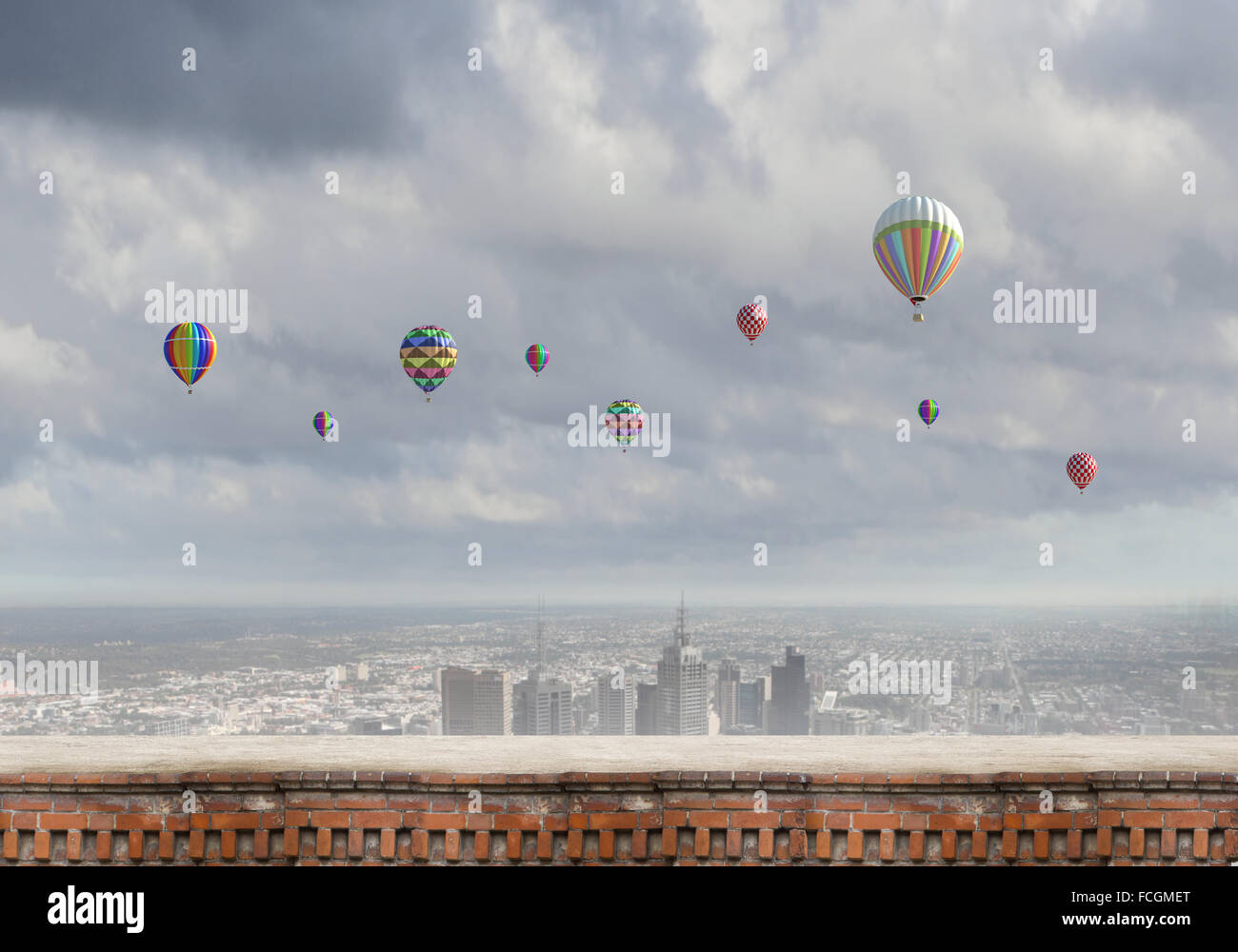 Colorful aerostats flying in clear sky above modern city Stock Photo ...