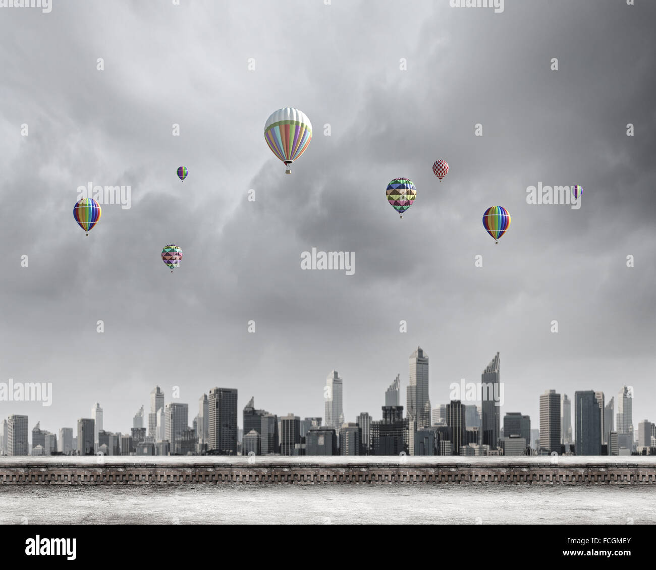 Colorful aerostats flying in clear sky above modern city Stock Photo ...