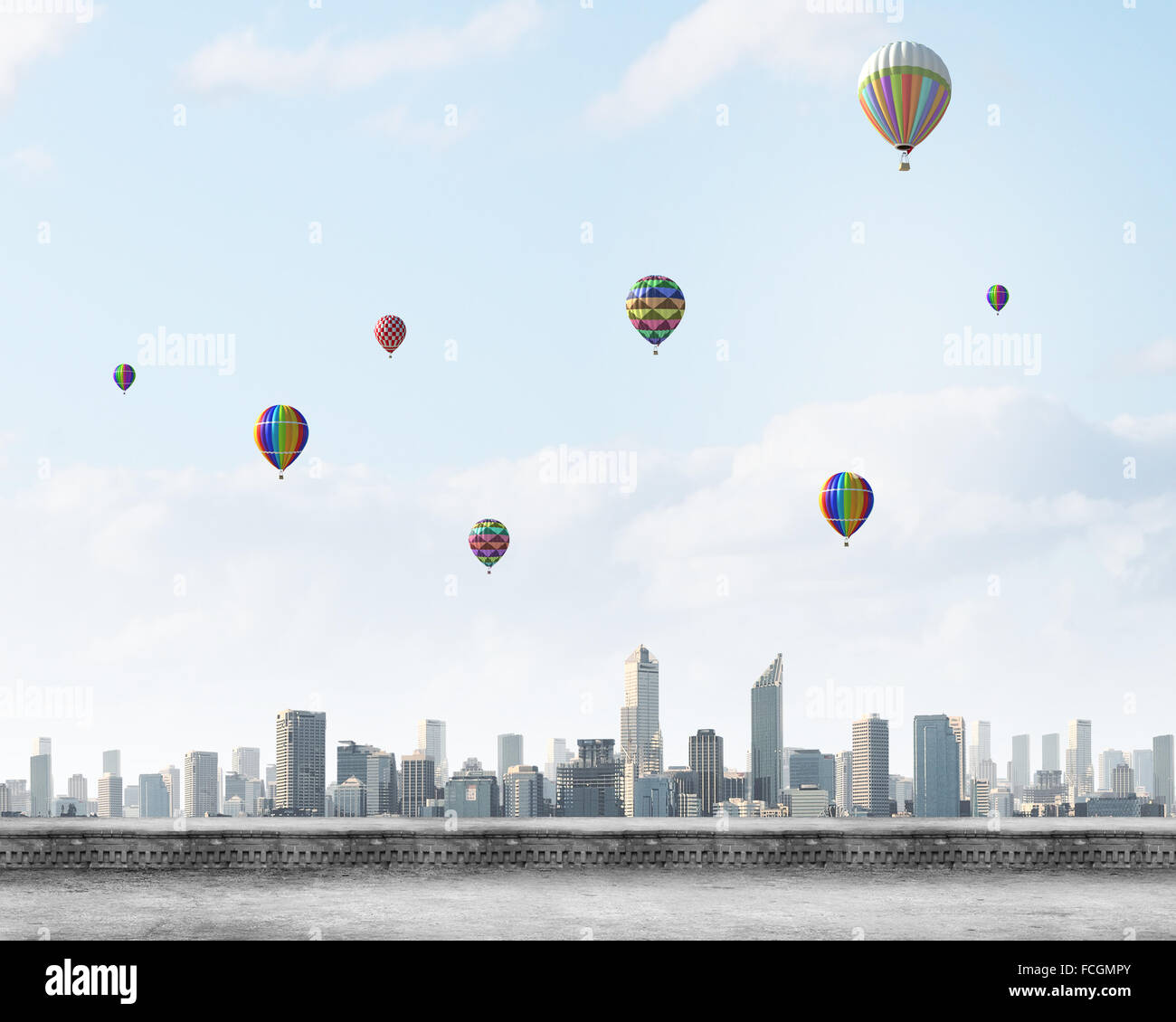 Colorful aerostats flying in clear sky above modern city Stock Photo ...