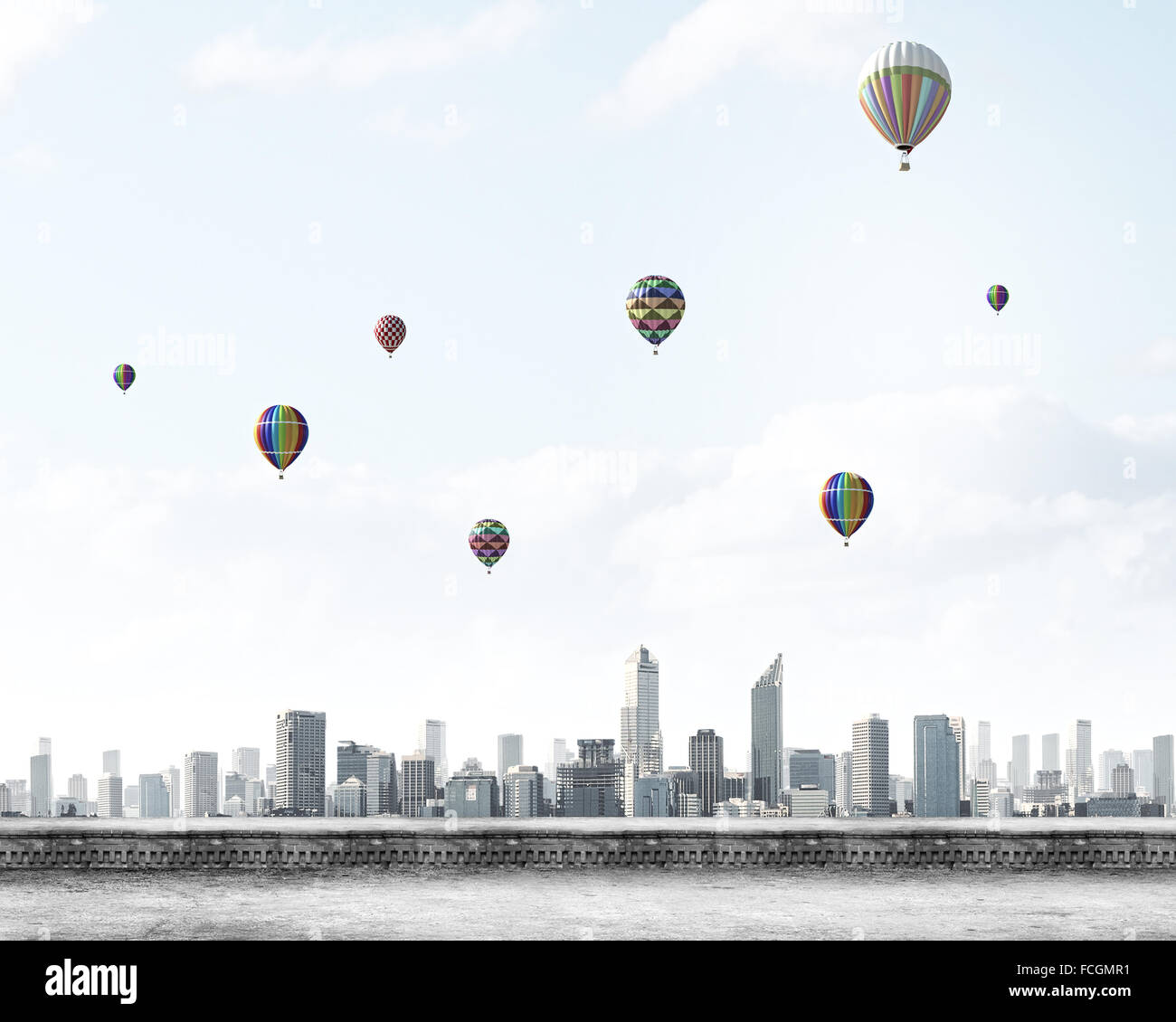 Colorful aerostats flying in clear sky above modern city Stock Photo ...