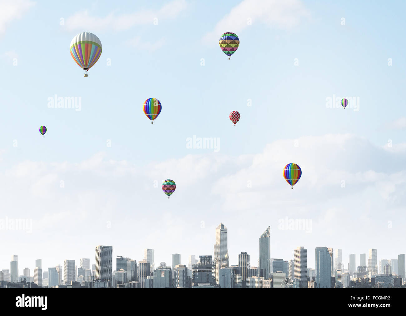 Colorful aerostats flying in clear sky above modern city Stock Photo ...