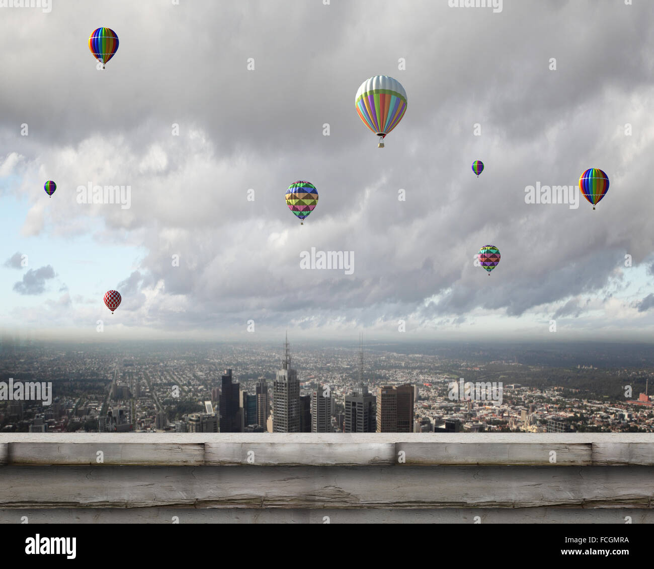 Colorful aerostats flying in clear sky above modern city Stock Photo ...