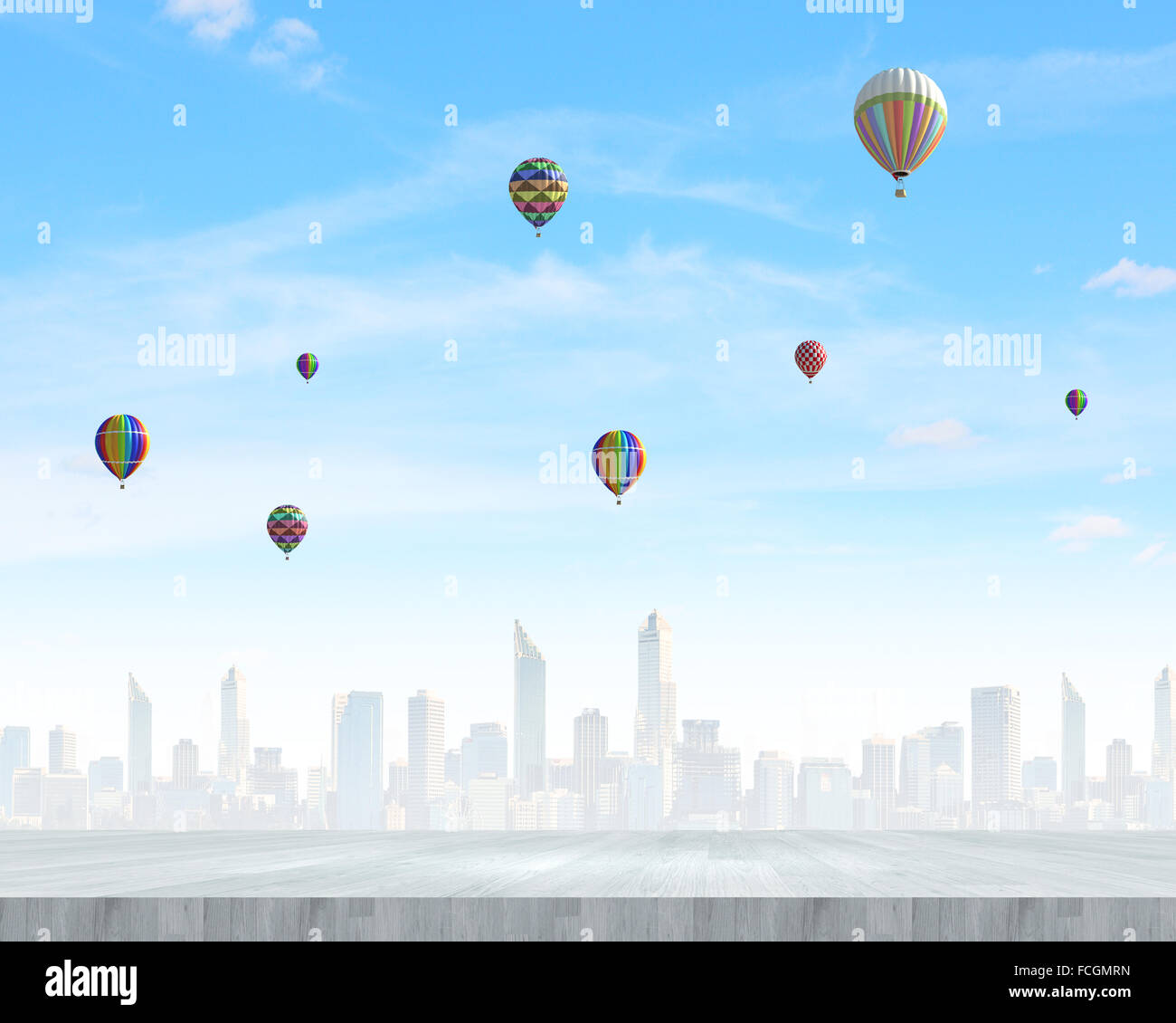 Colorful aerostats flying in clear sky above modern city Stock Photo ...
