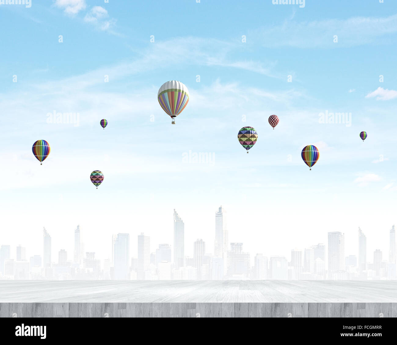 Colorful aerostats flying in clear sky above modern city Stock Photo ...