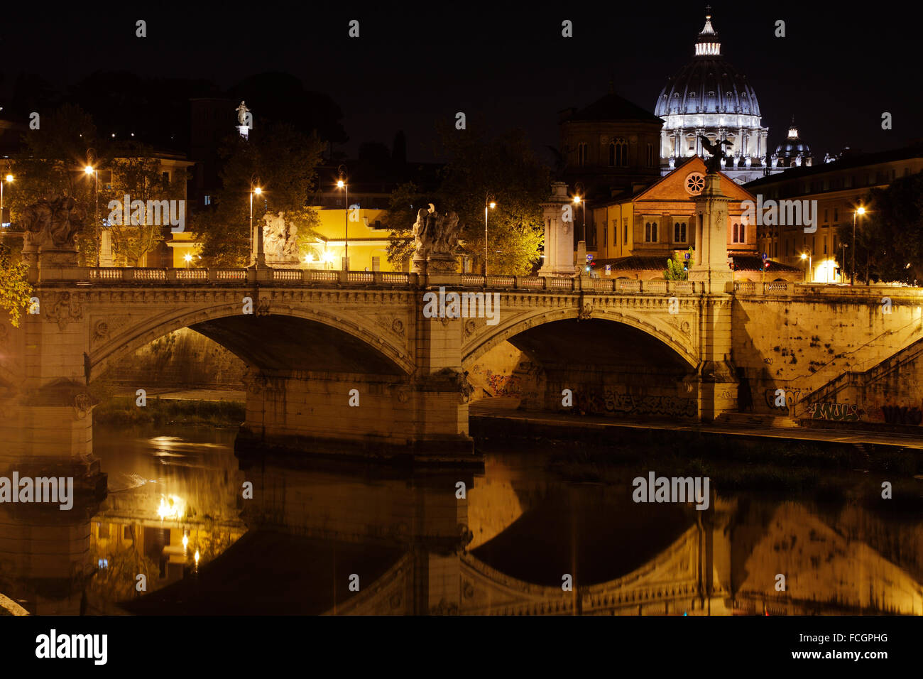 Tiber with Sant'Angelo bridge and the St. Peter's Basilica in Rome, Italy Stock Photo