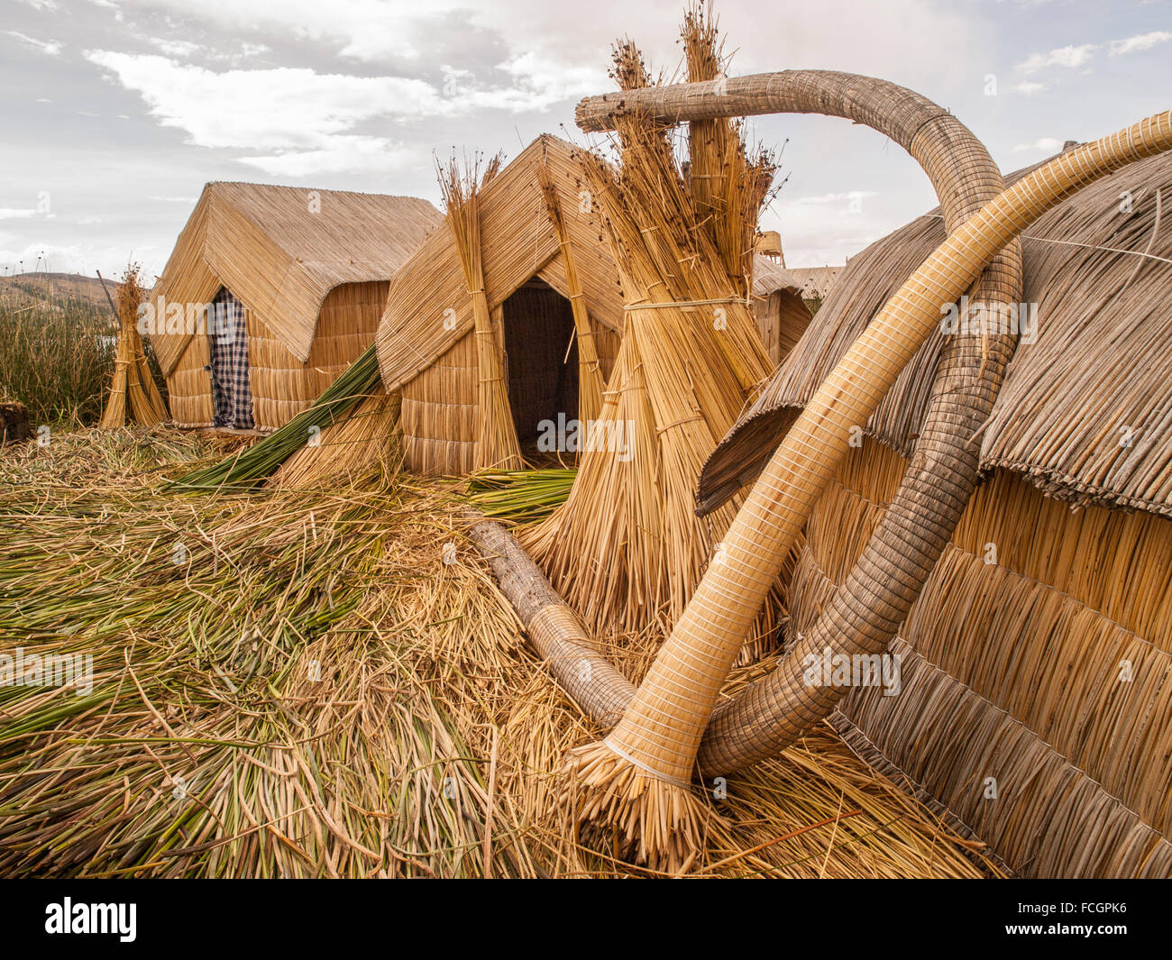 Straw huts on floating island, Lake Titicaca, Peru. Stock Photo
