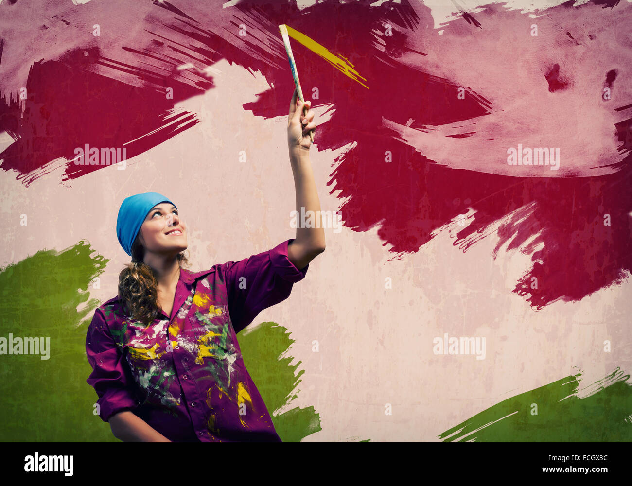 Young woman painting wall in colors with brush Stock Photo - Alamy