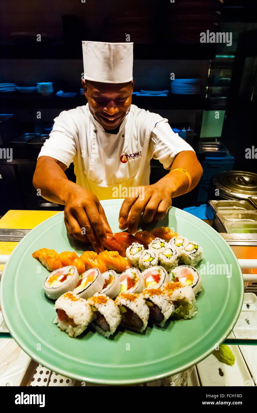 A chef prepares a plate of sushi at the sushi bar, at Nobu Restaurant, Cape  Town, South Africa. There are 22 Nobu locations Stock Photo - Alamy