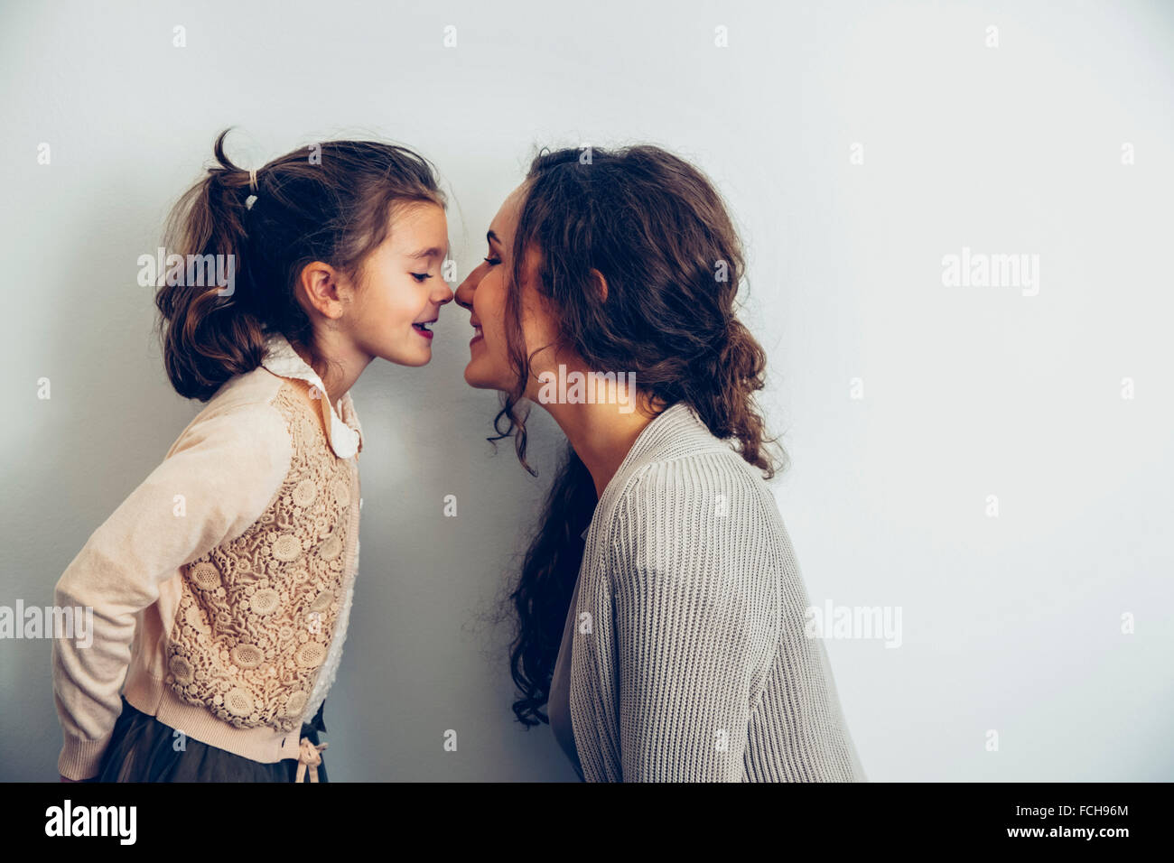 Happy mother and daughter rubbing noses Stock Photo Alamy