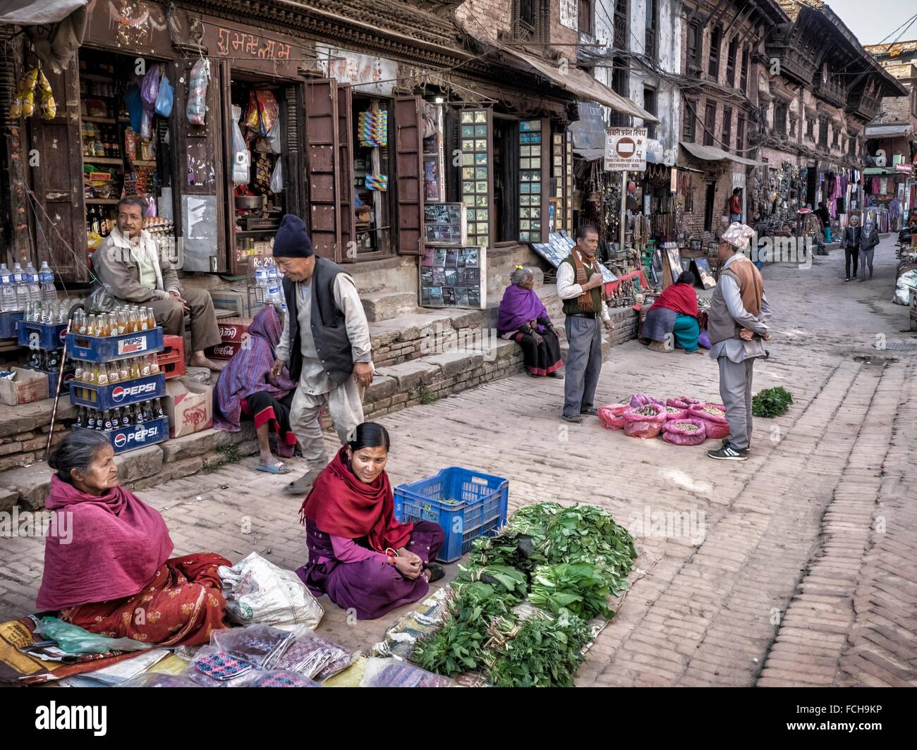 Pile of colorist plastic pails and buckets set for sale at the entrance of  a shop in a street of the old city area-Panauti-Nepal Stock Photo - Alamy