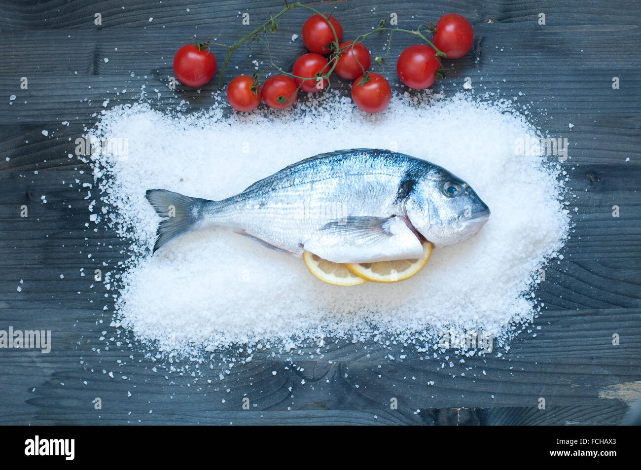 Bream cooked in salt and then baked in the oven,italy Stock Photo