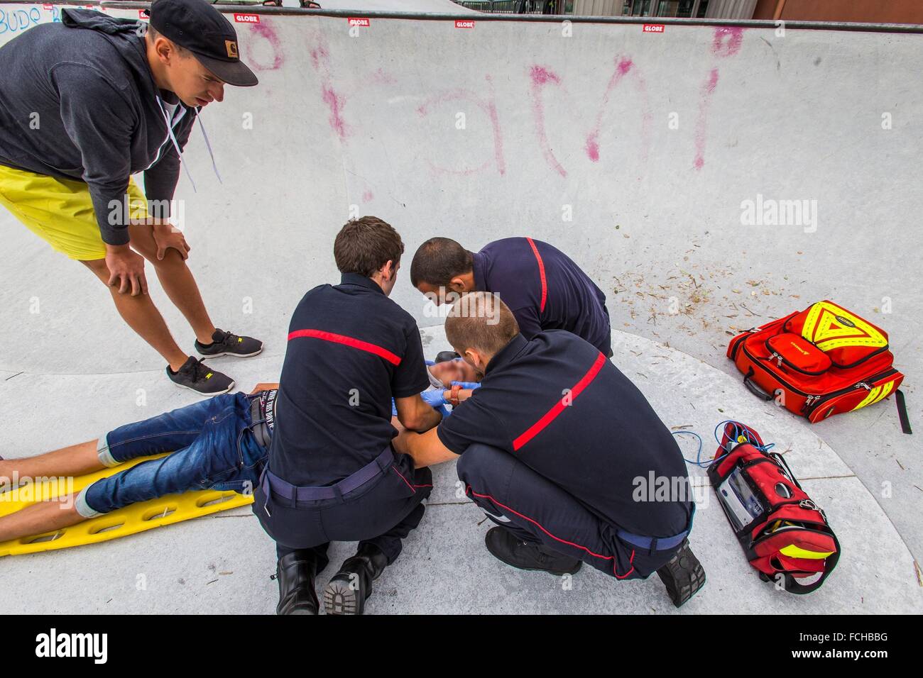 FIREFIGHTERS RESPONDING TO AN EMERGENCY IN A SKATEPARK Stock Photo