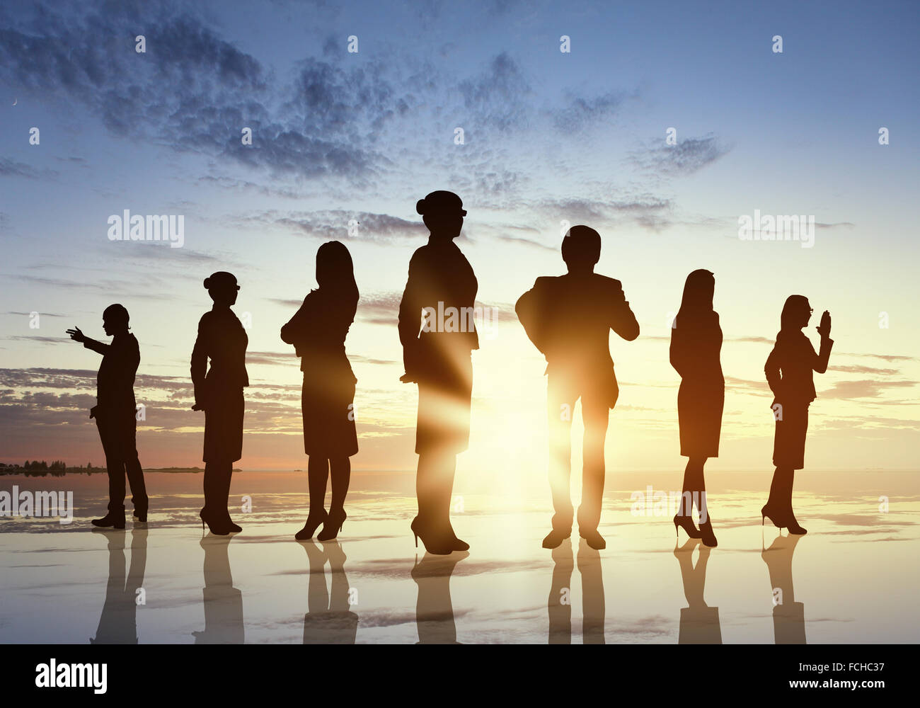 Silhouettes of business people standing in line Stock Photo - Alamy