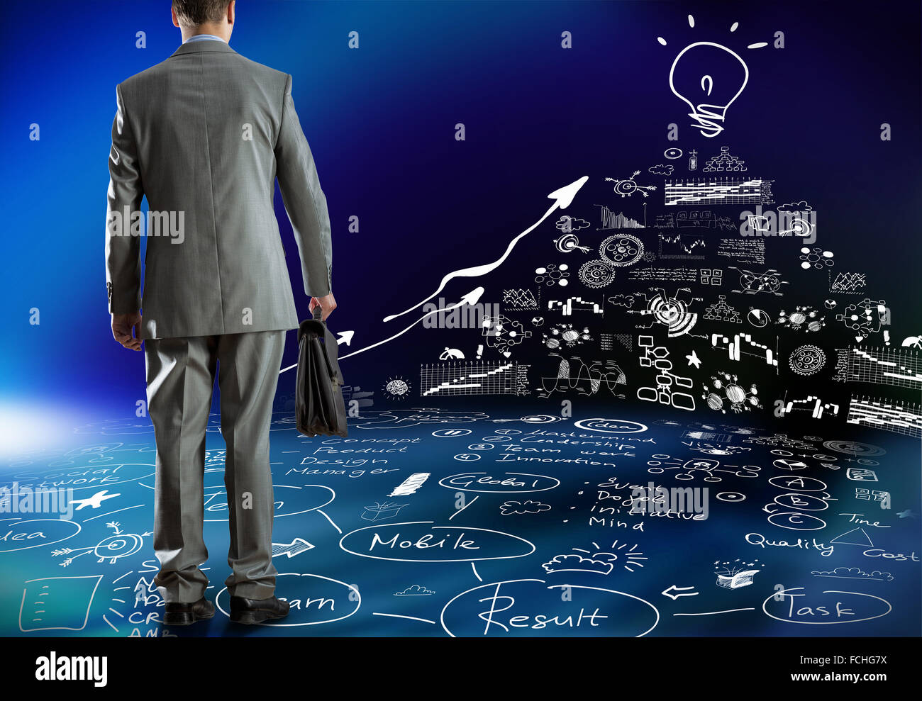 Rear view of businessman and business strategy sketches on wall Stock ...