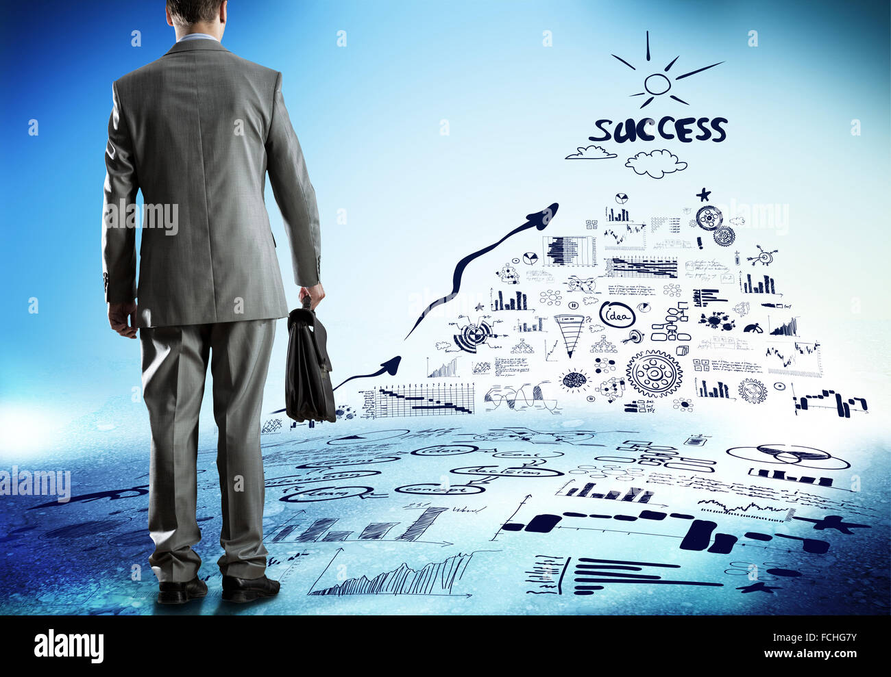 Rear view of businessman and business strategy sketches on wall Stock ...