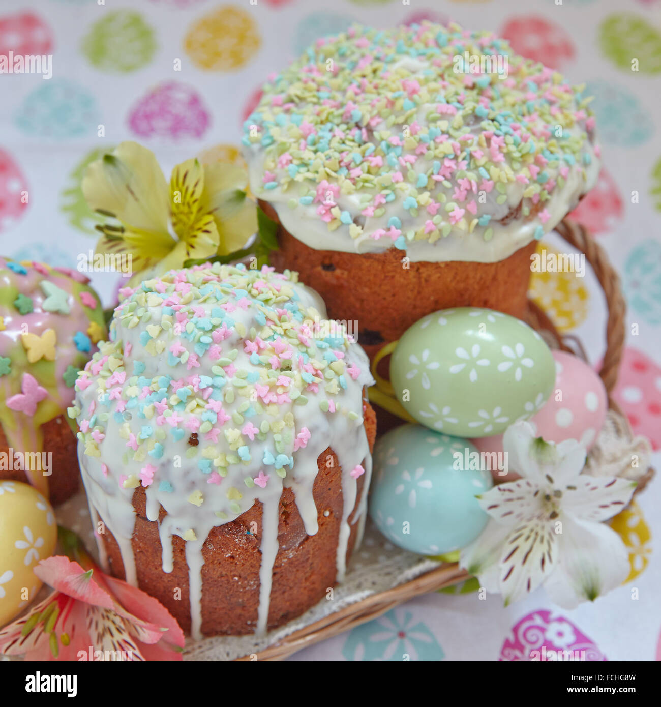 Easter cake with glace icing and colored easter eggs Stock Photo - Alamy