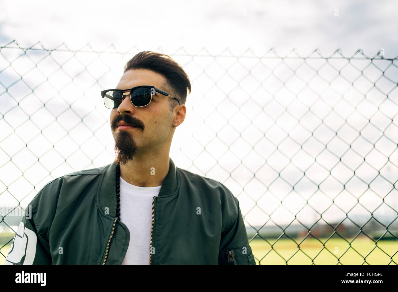 Portrait of a stylish young man wearing sunglasses Stock Photo - Alamy