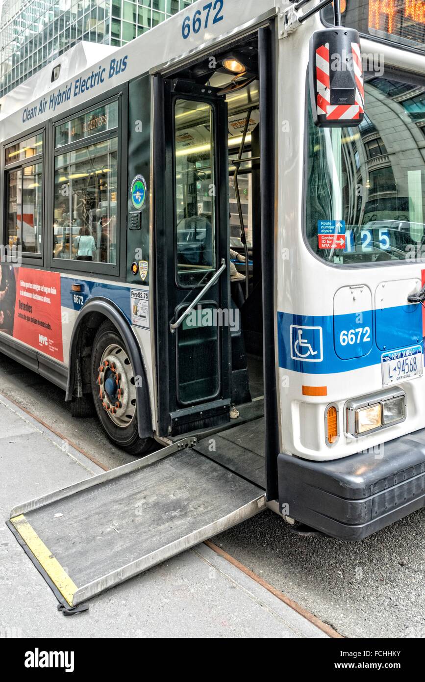 an m4 manhattan new york city bus parked at the curb to pick up and