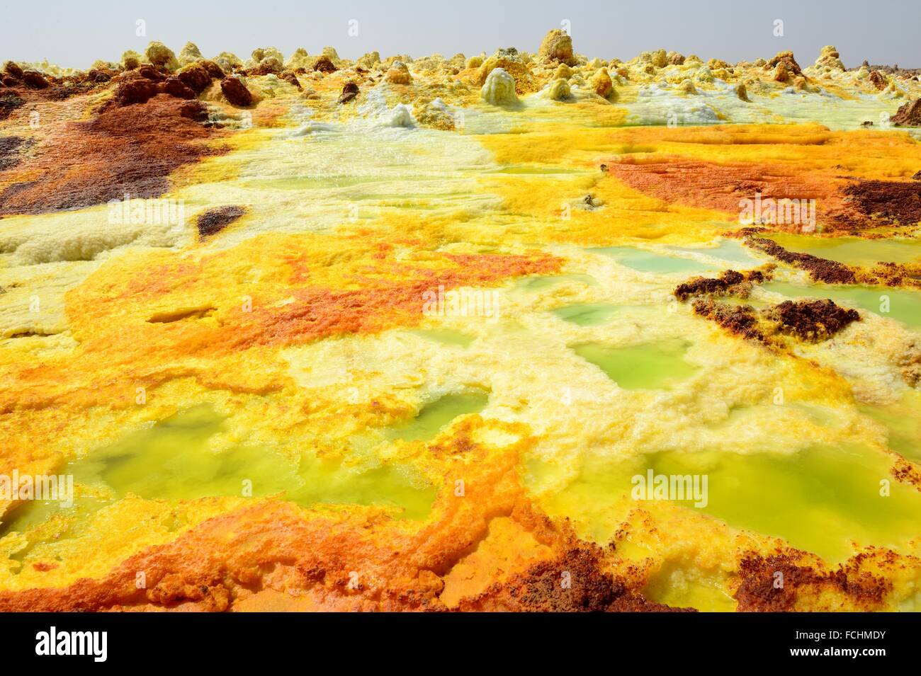 Dallol hot spring with salt concretions coloured by sulphur, potassium