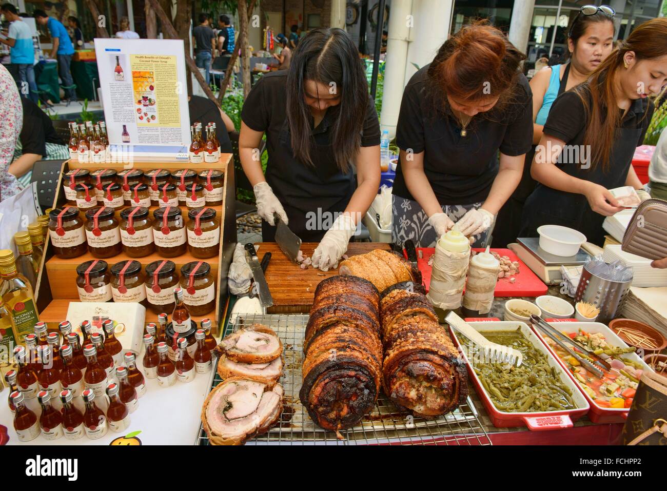 Serving porchetta sandwiches at the Farmers Market, Bangkok, Thailand