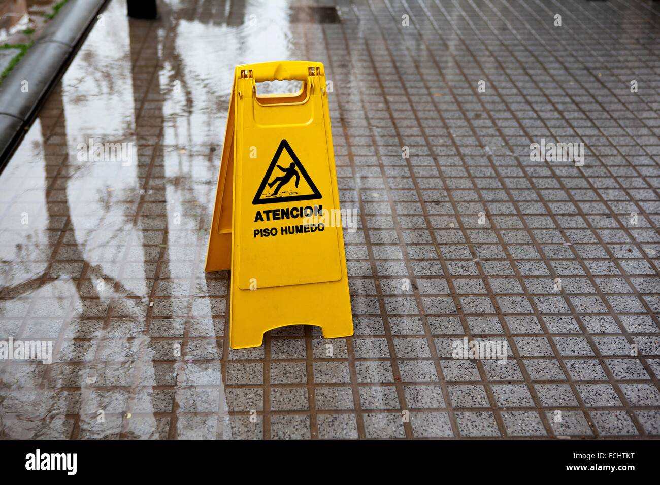 Wet floor sign in the street, Valencia, Spain Stock Photo