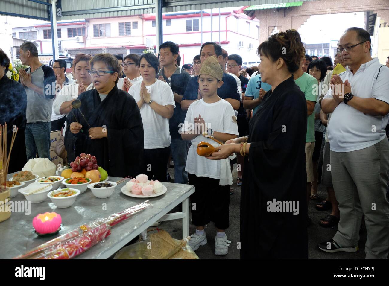 Prayers before the final journey begins. Sarawakian chinese funeral ceremony. Malaysia Stock