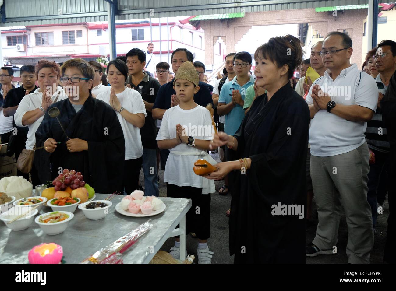 Prayers before the final journey begins. Sarawakian chinese funeral ceremony. Malaysia Stock