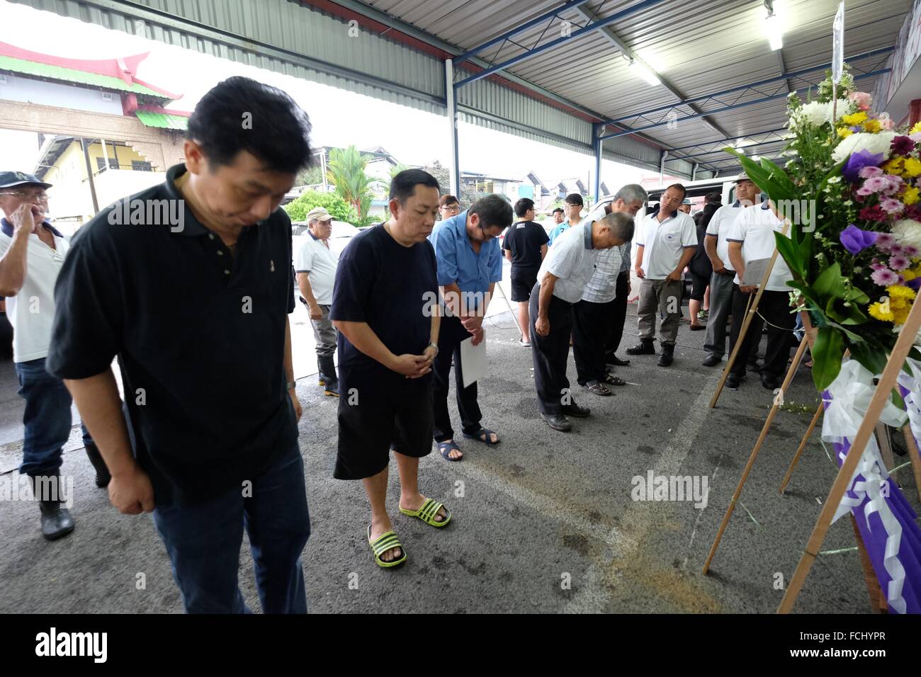 Friends paying their final respect. Sarawakian chinese funeral ceremony. Malaysia Stock Photo