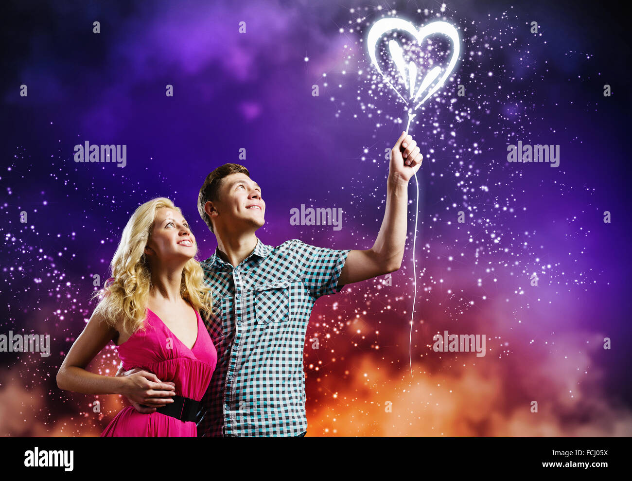 Young happy romantic couple hugging each other Stock Photo - Alamy
