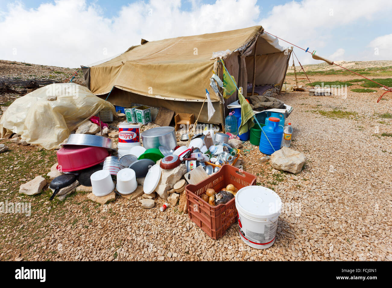 Tent and kitchenware belonging to goat shepherds in the mountains, Lebanon Stock Photo