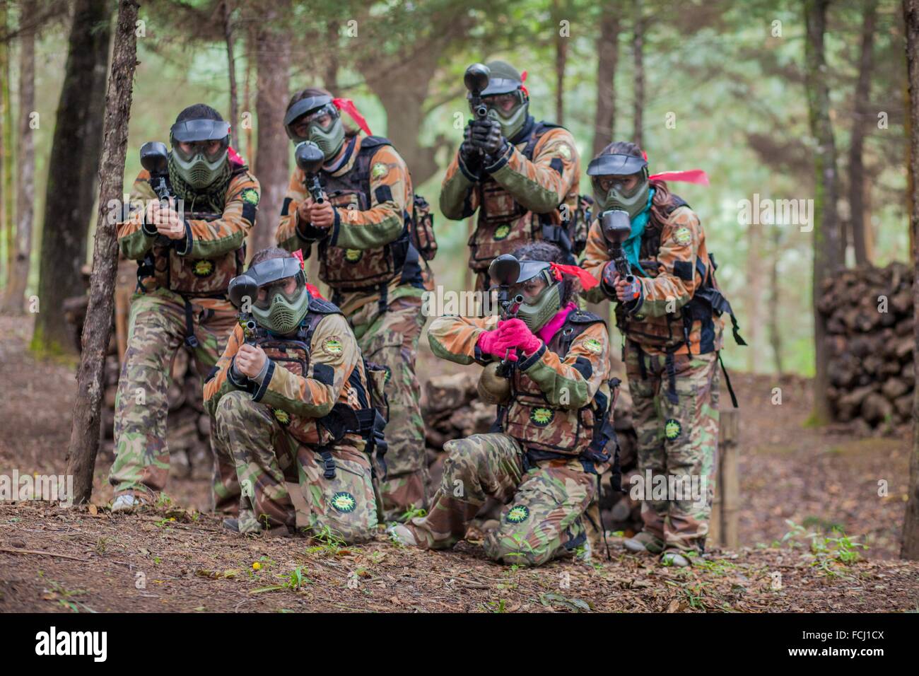 Group of paintballers posing Stock Photo - Alamy