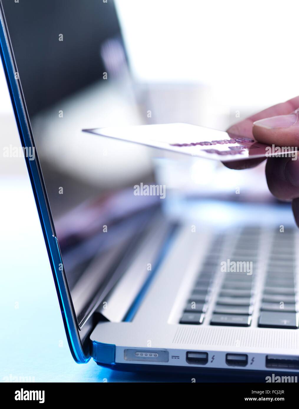 PROPERTY RELEASED. Person shopping on-line with credit card. Stock Photo