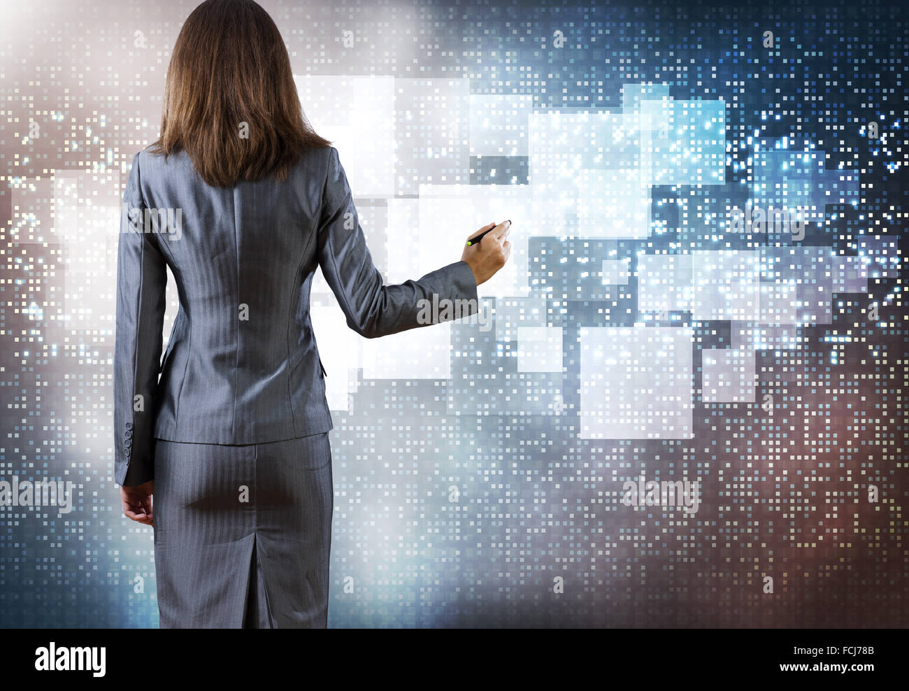 Rear view of businesswoman drawing on media screen Stock Photo - Alamy