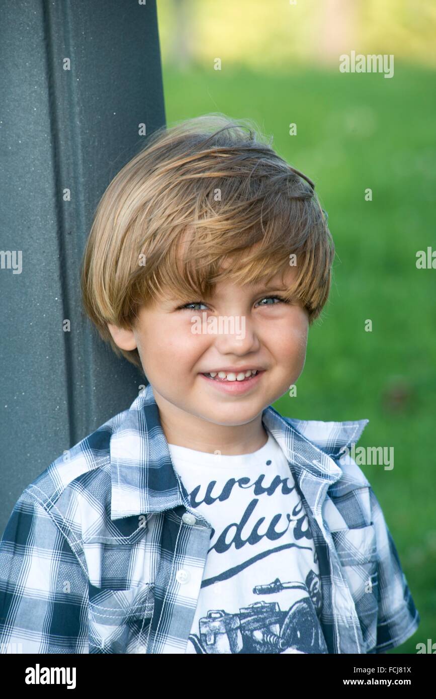 Portrait of a small boy smiling at camera Stock Photo Alamy