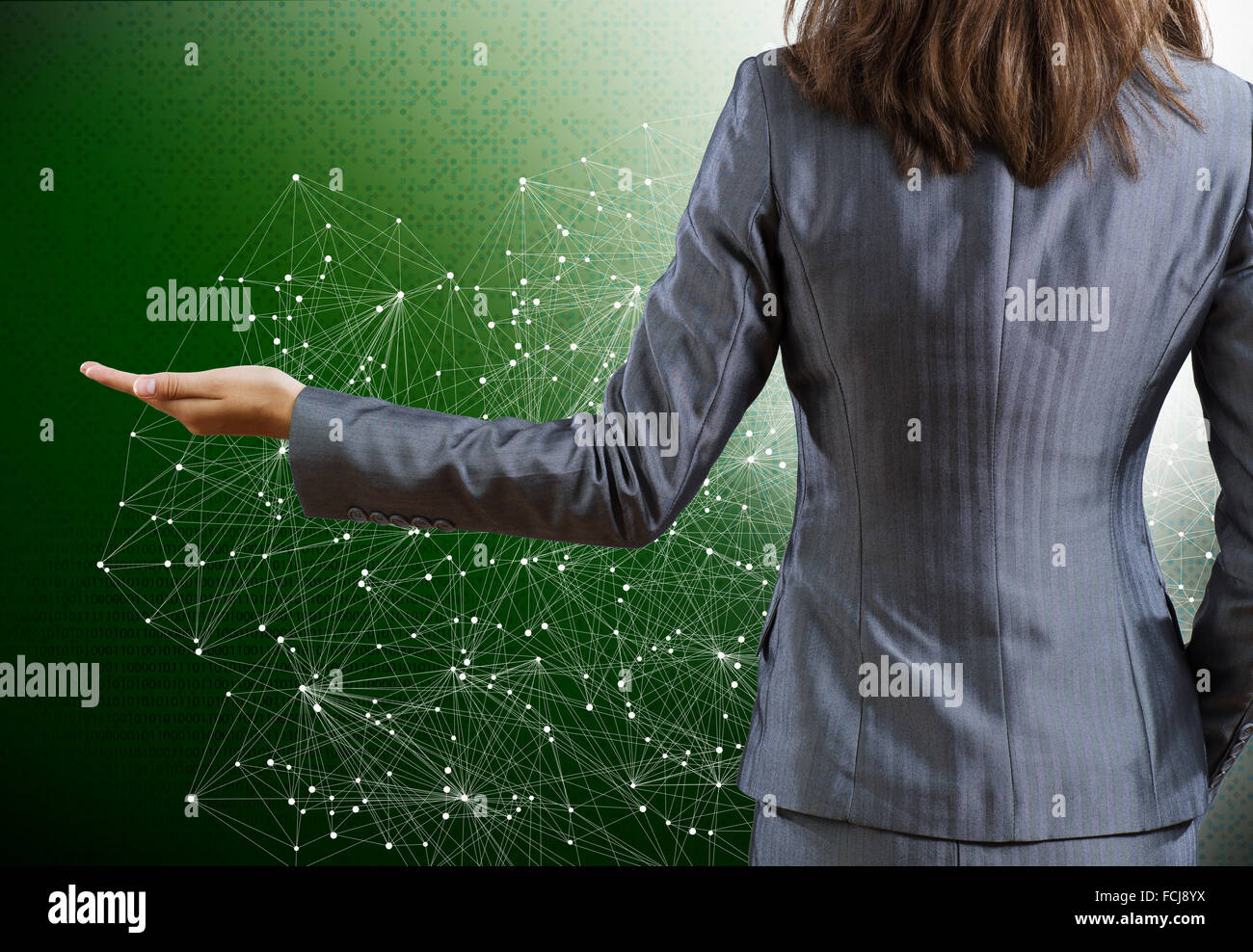 Rear view of businesswoman against digital background Stock Photo - Alamy
