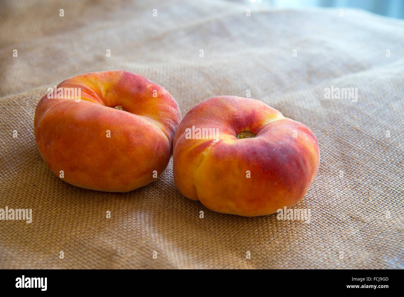 Still life: two paraguayas, similar fruit to peach. Stock Photo