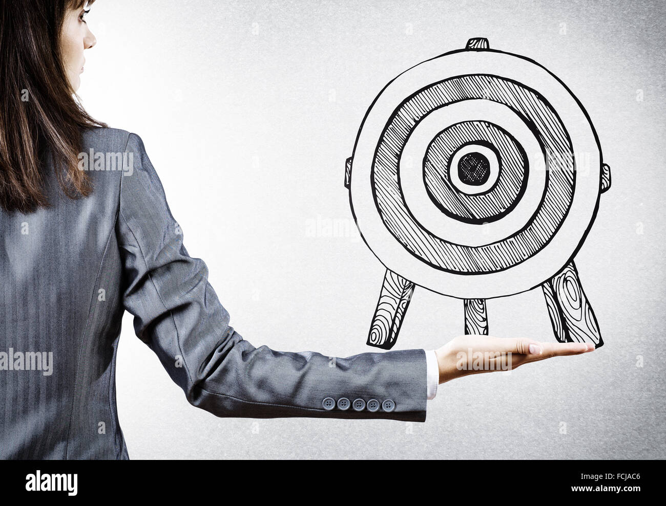 Full Person Rear View Target Rear view of businesswoman pointing at drawn target Stock Photo - Alamy