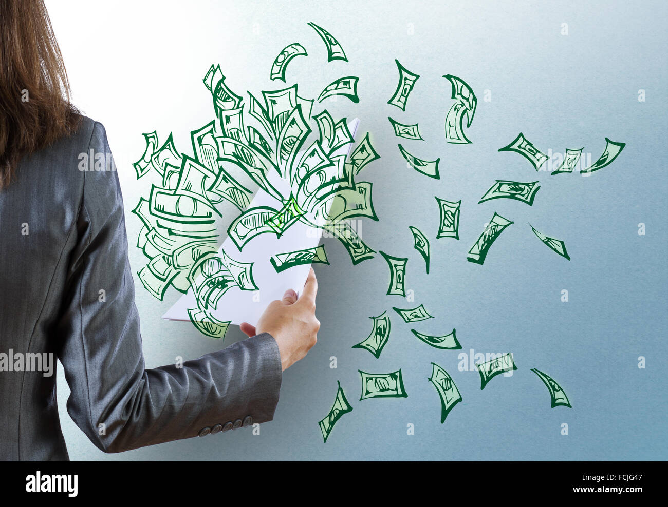 Rear view of businesswoman and money banknotes flying in air Stock ...