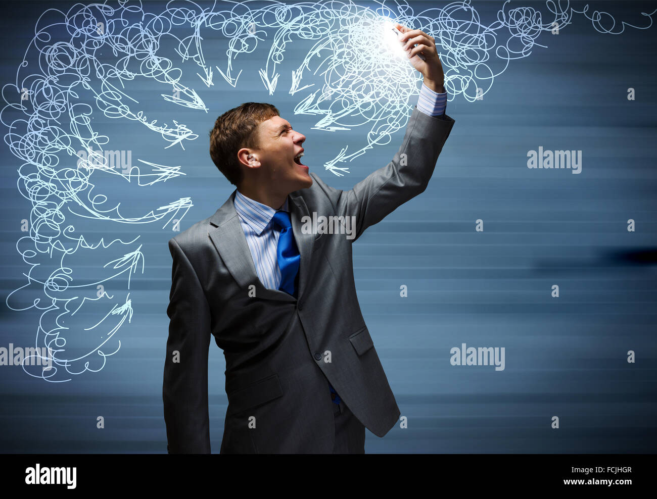 Angry businessman screaming furiously in mobile phone Stock Photo