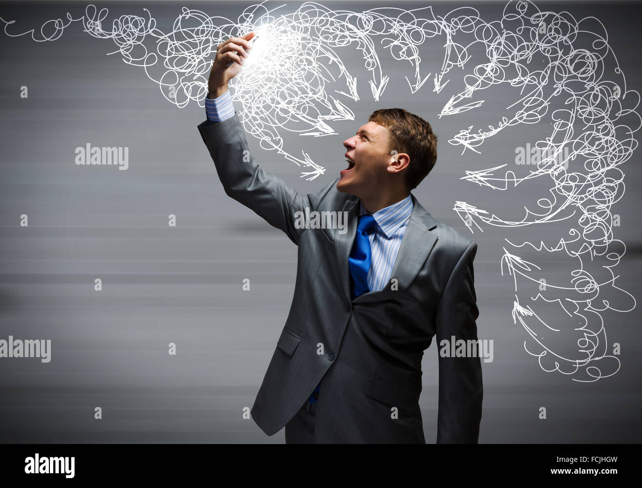 Angry businessman screaming furiously in mobile phone Stock Photo